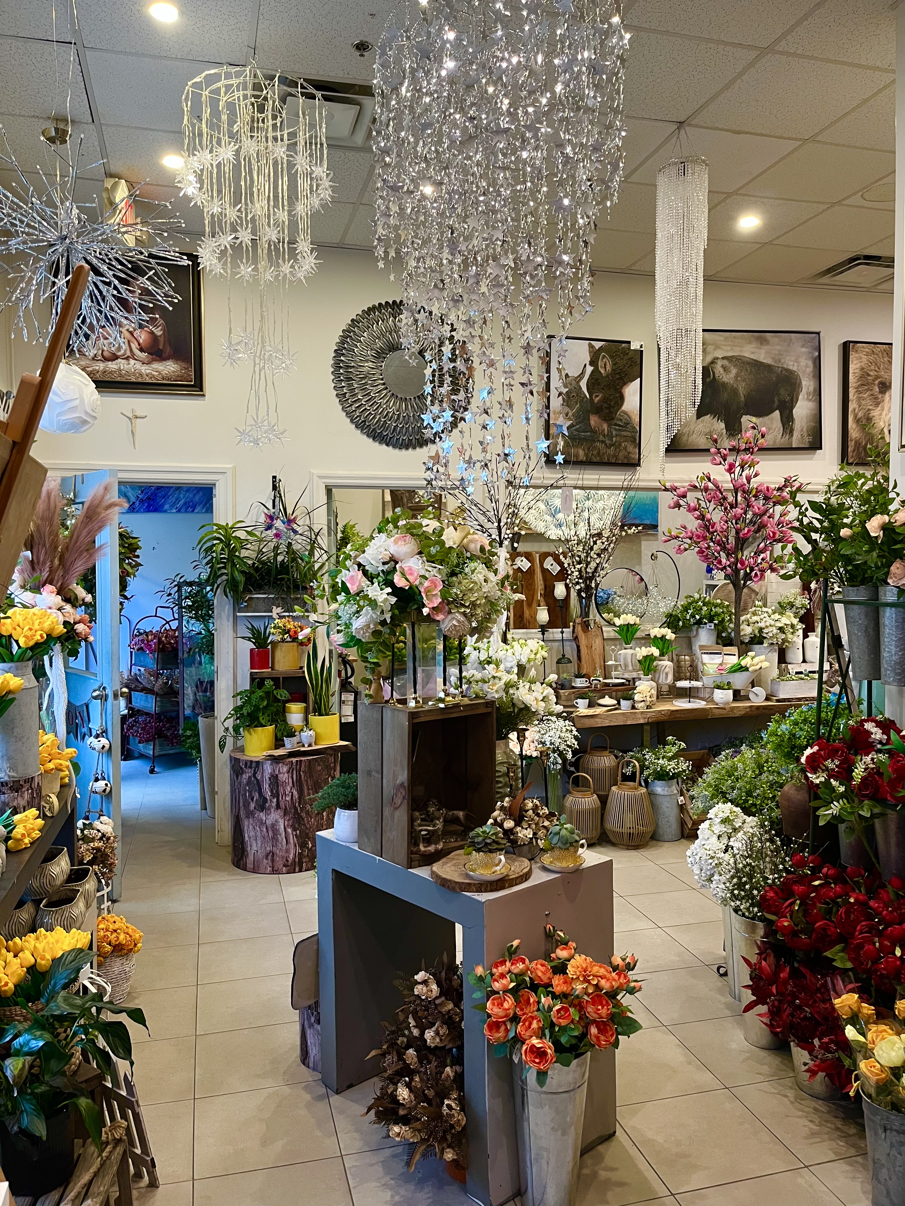 Inside Something Different boutique — flowers, art, and handcrafted decor fill the sunlit shop